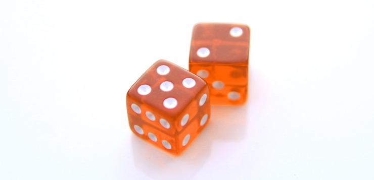 Closeup of a pair of red dices over white background