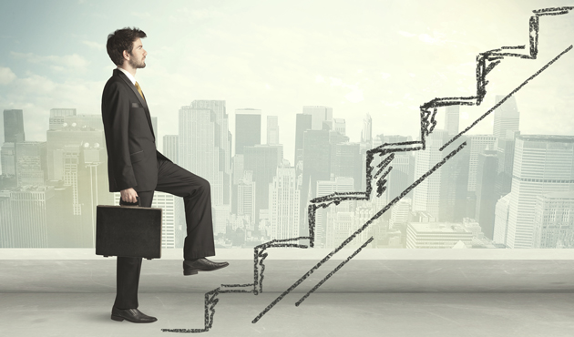 Business man climbing up on hand drawn staircase concept