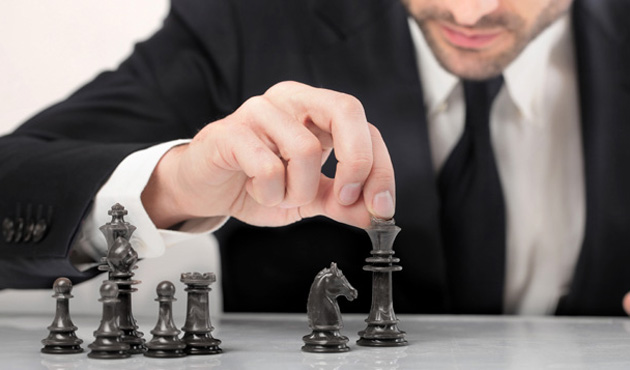 17664594 - young businessman playing chess